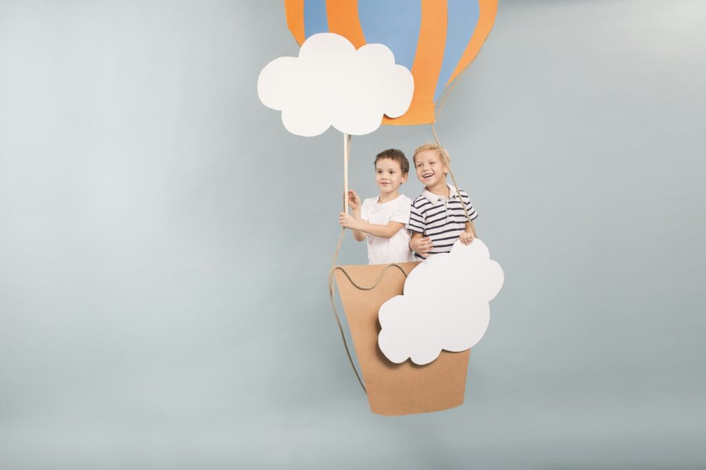 Boys flying in baloon